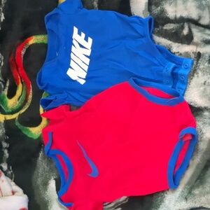 Two Nike onesies size 9 months
